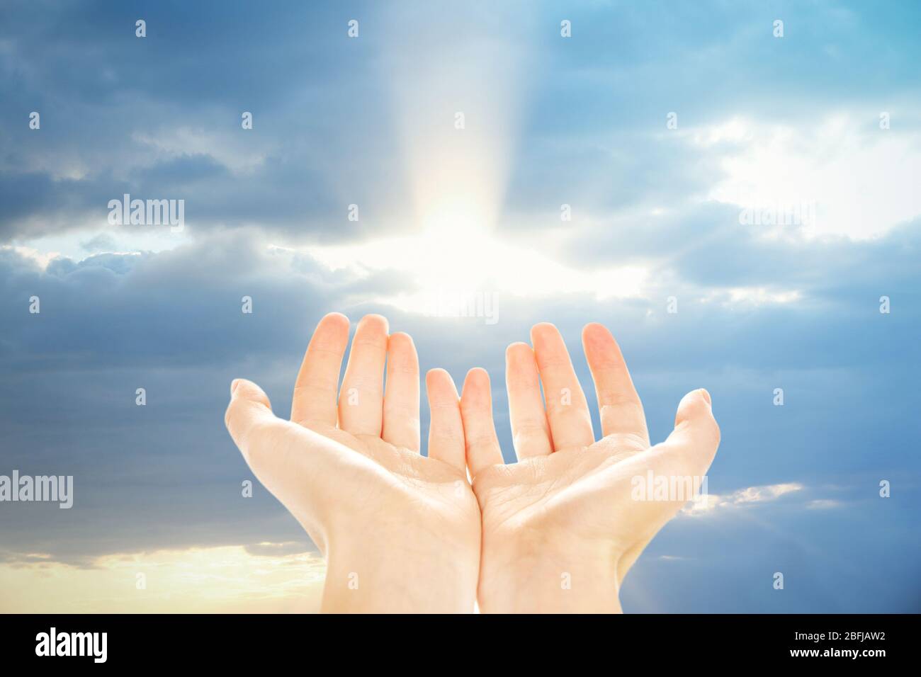 Human hands on sky background Stock Photo - Alamy