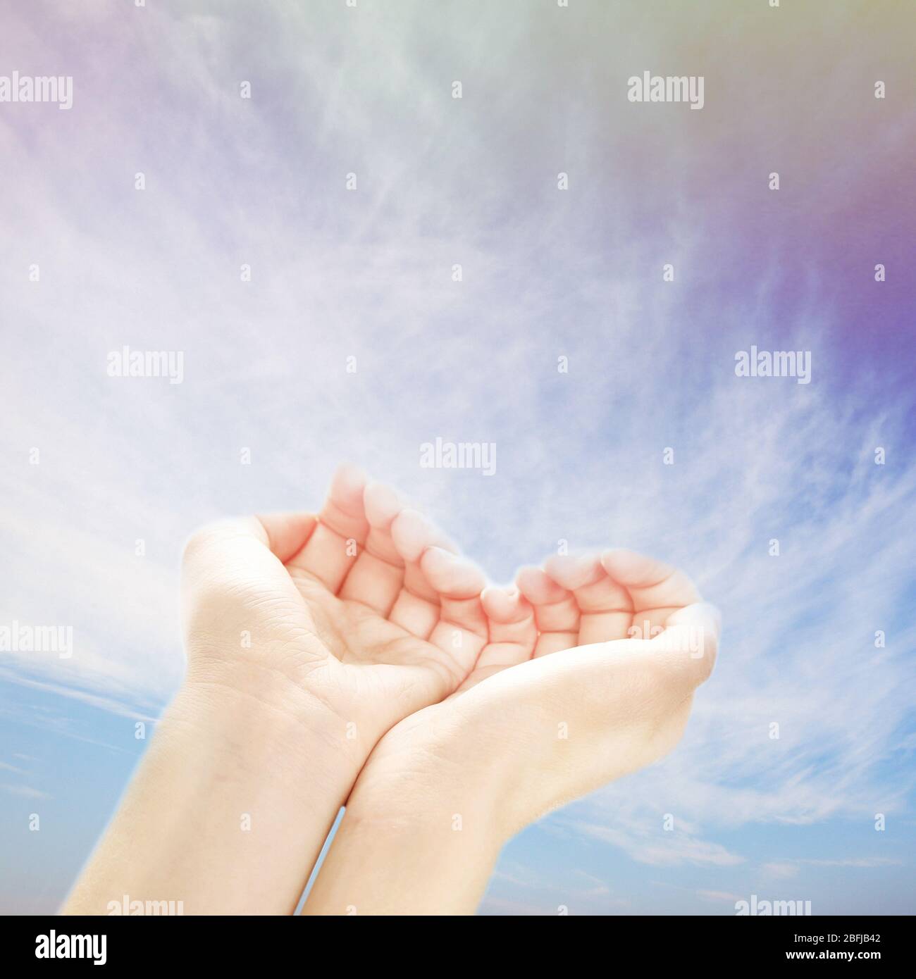Human hands on sky background Stock Photo - Alamy