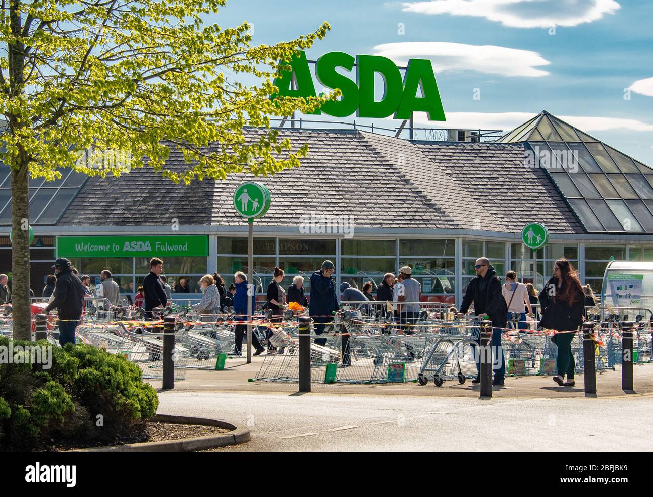 Preston, Lancashire, UK Shoppers queuing in the social distancing lines outside ASDA supermarket, Fulwood, Preston, Lancashire, UK. Credit: John Eveson/Alamy Live News Stock Photo