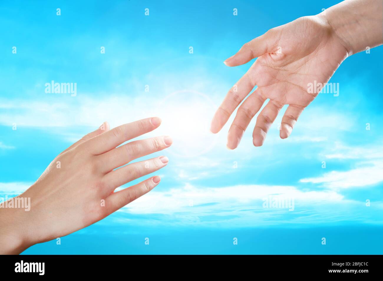Human hands on sky background Stock Photo - Alamy