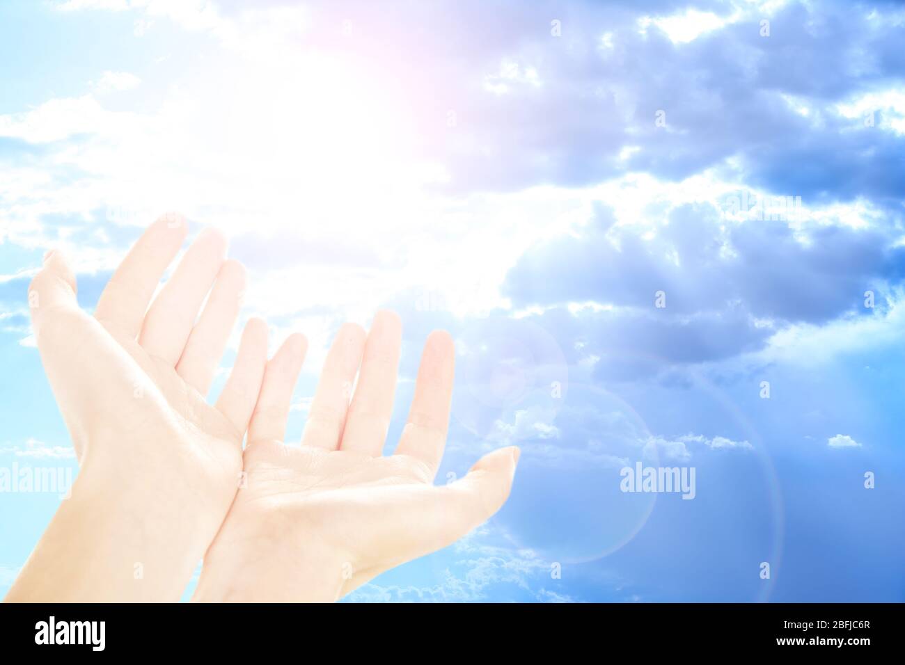 Human hands on sky background Stock Photo - Alamy
