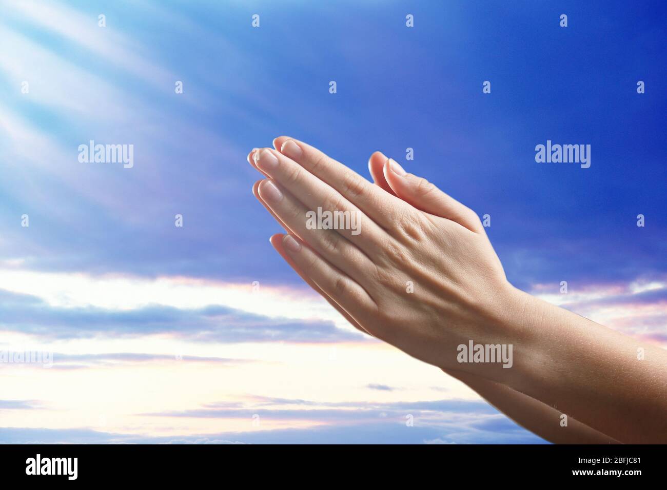 Human hands on sky background Stock Photo - Alamy