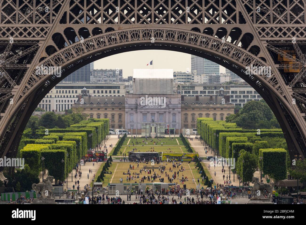 View of Parc de la Tour Eiffel through the foundation arch of the Eiffel Tower, Paris Stock Photo