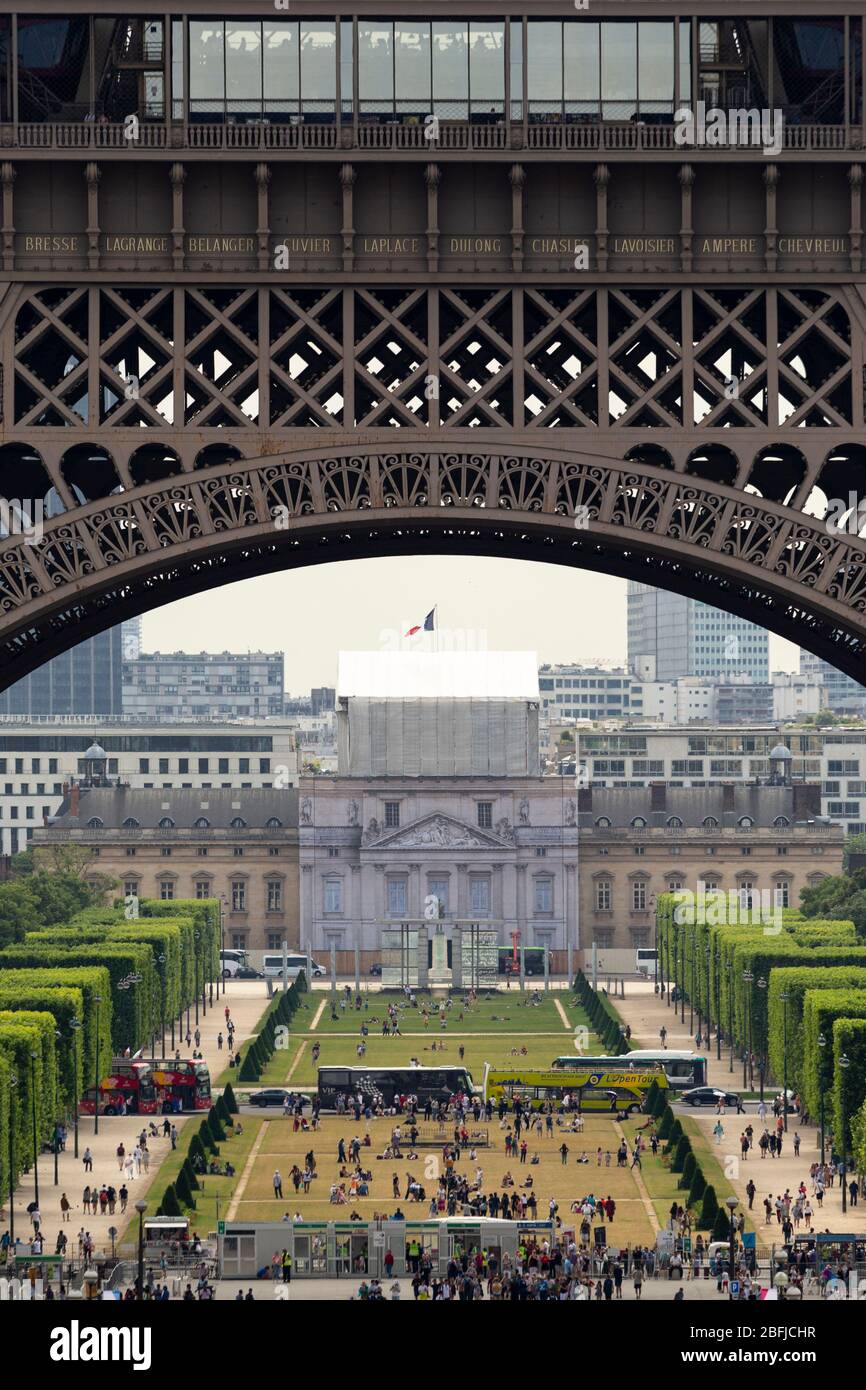 View of Parc de la Tour Eiffel through the foundation arch of the Eiffel Tower, Paris Stock Photo