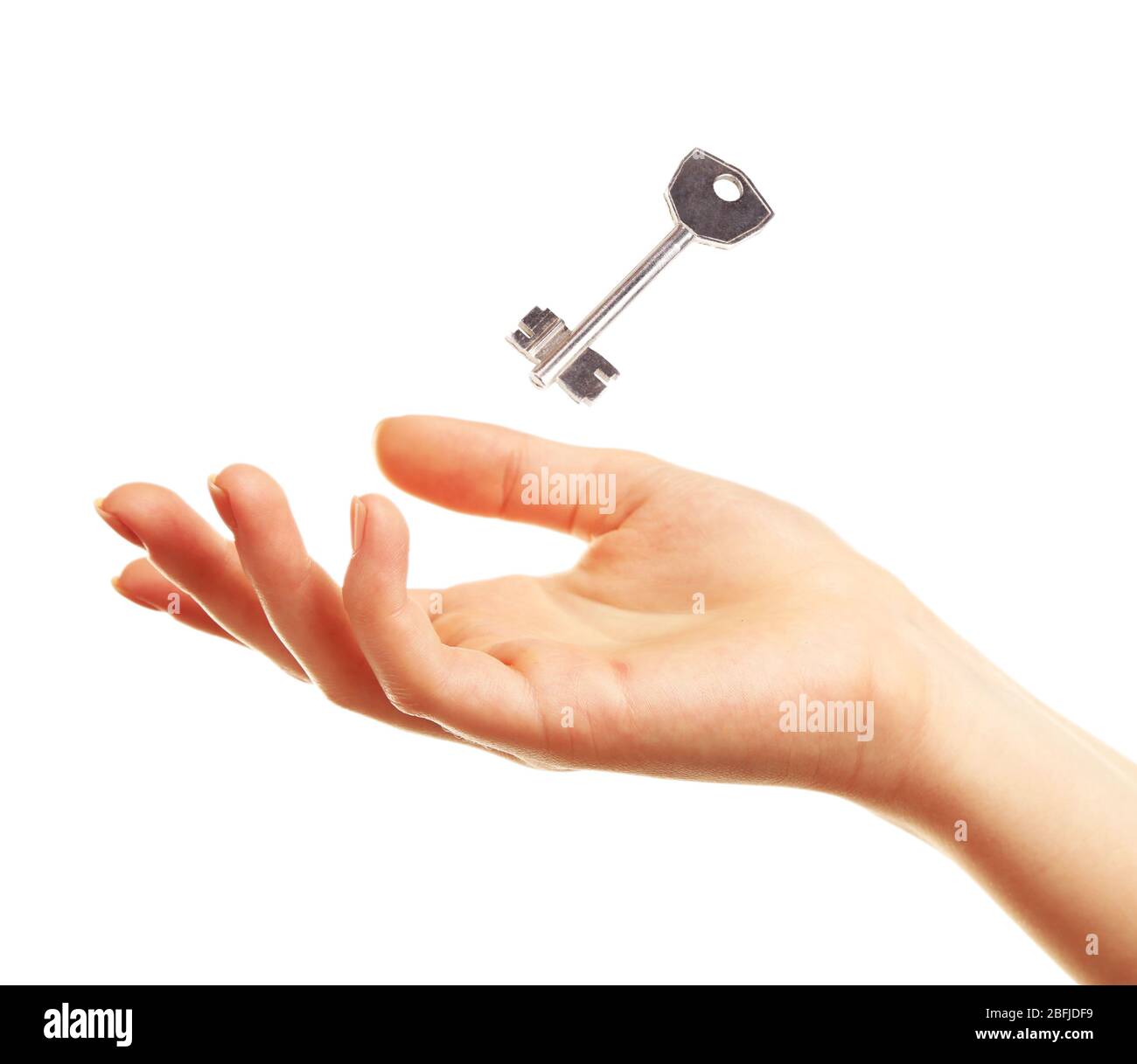 Female hand with key isolated on white Stock Photo - Alamy