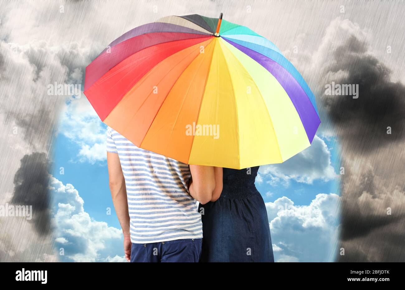 Beautiful loving couple with umbrella in rain day Stock Photo - Alamy