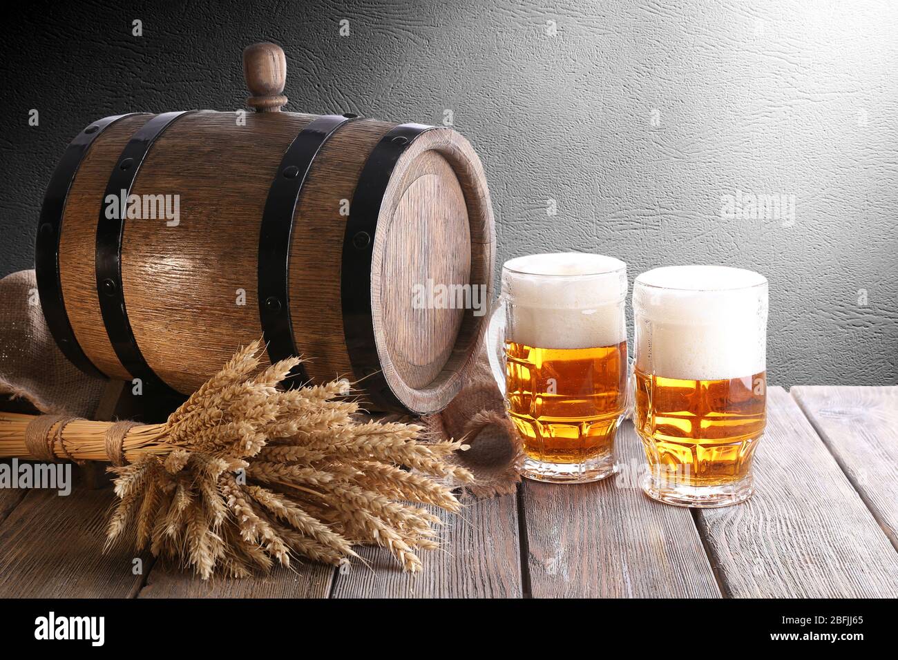 Beer barrel with beer glasses on table Stock Photo