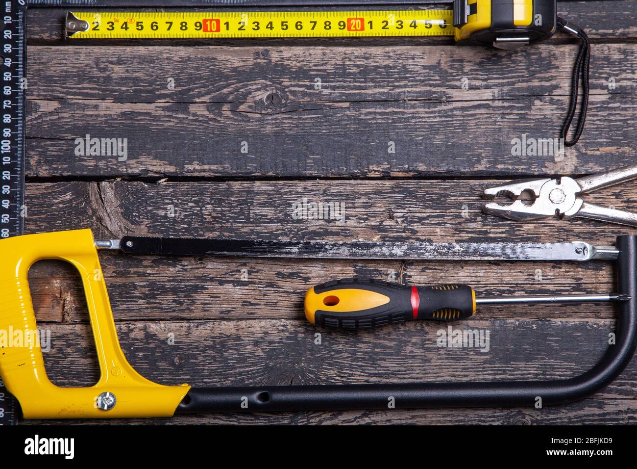 old carpentry tools on wooden background Stock Photo