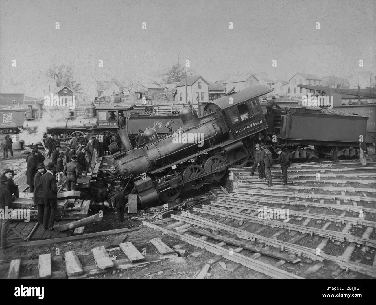 This SOO Line steam train Engine 417 crashed into the round house's turntable. The SOO Line was owned by the Canadian Pacific Railway, as of 1888. This accident may have occurred in Ladysmith, Wis. USA    To see my related vintage images, Search:  Prestor  vintage  vehicle Stock Photo