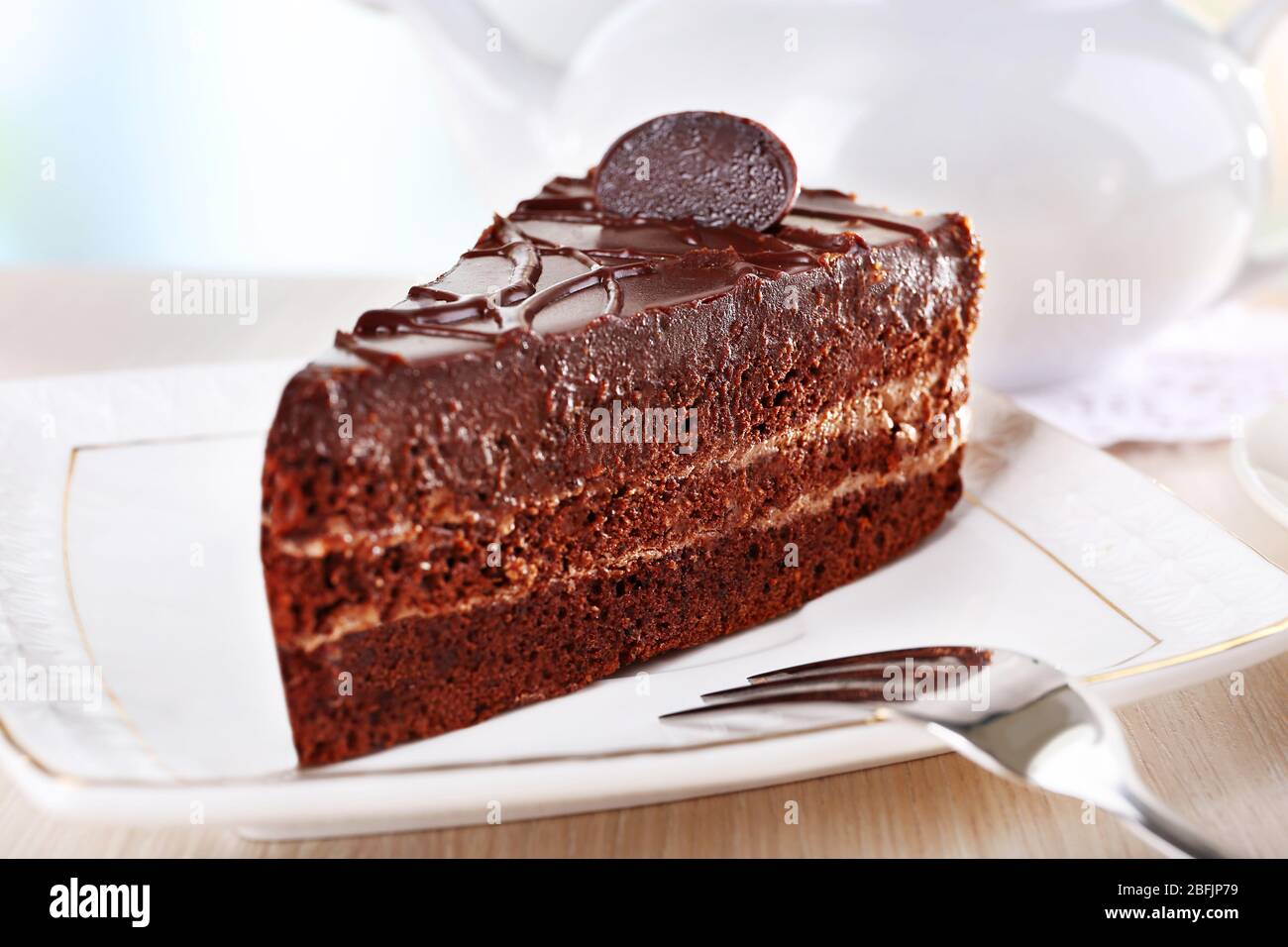 Piece of chocolate cake on plate Stock Photo - Alamy