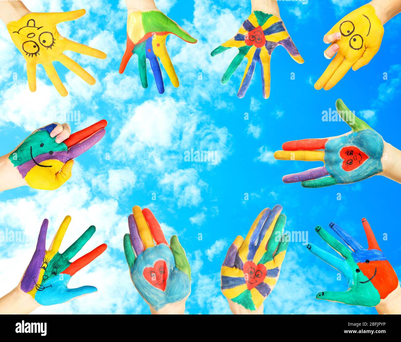 Painted hands on sky background Stock Photo - Alamy