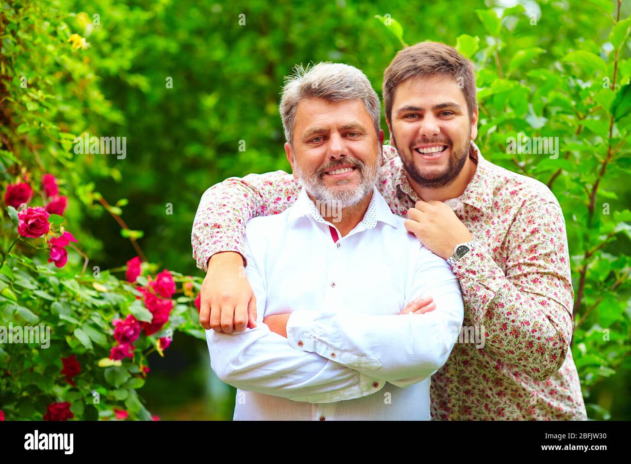 portrait of happy father and son, which are similar in appearance Stock ...