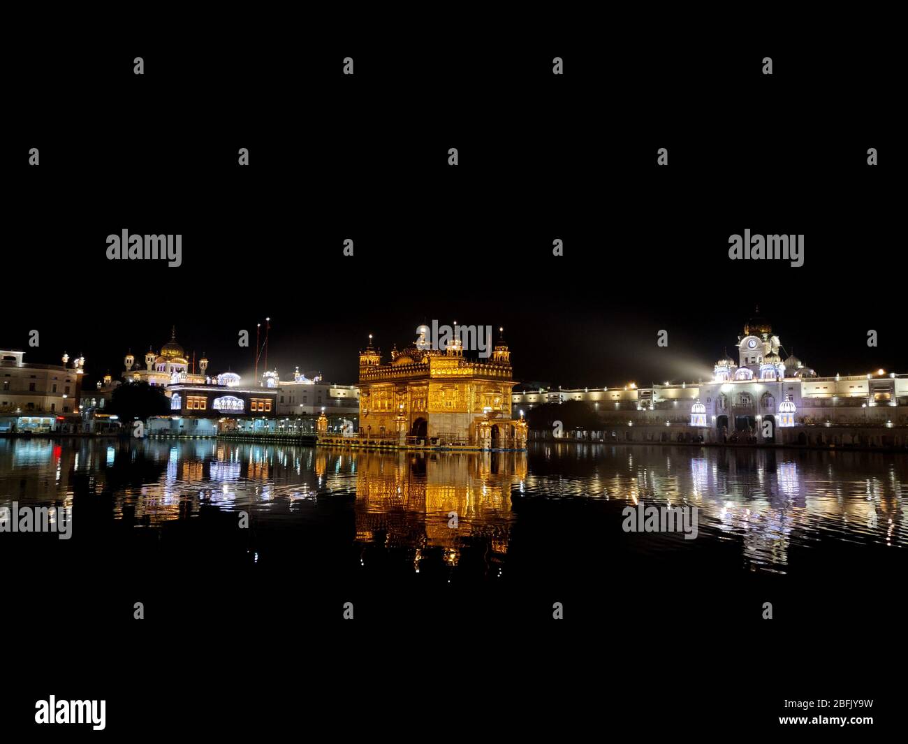 Golden Temple shining bright at night in Amritsar Stock Photo