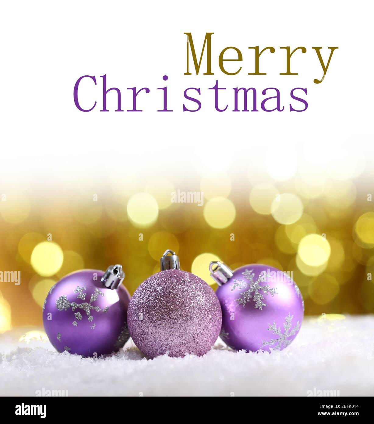 Christmas balls in snow on bright background Stock Photo - Alamy