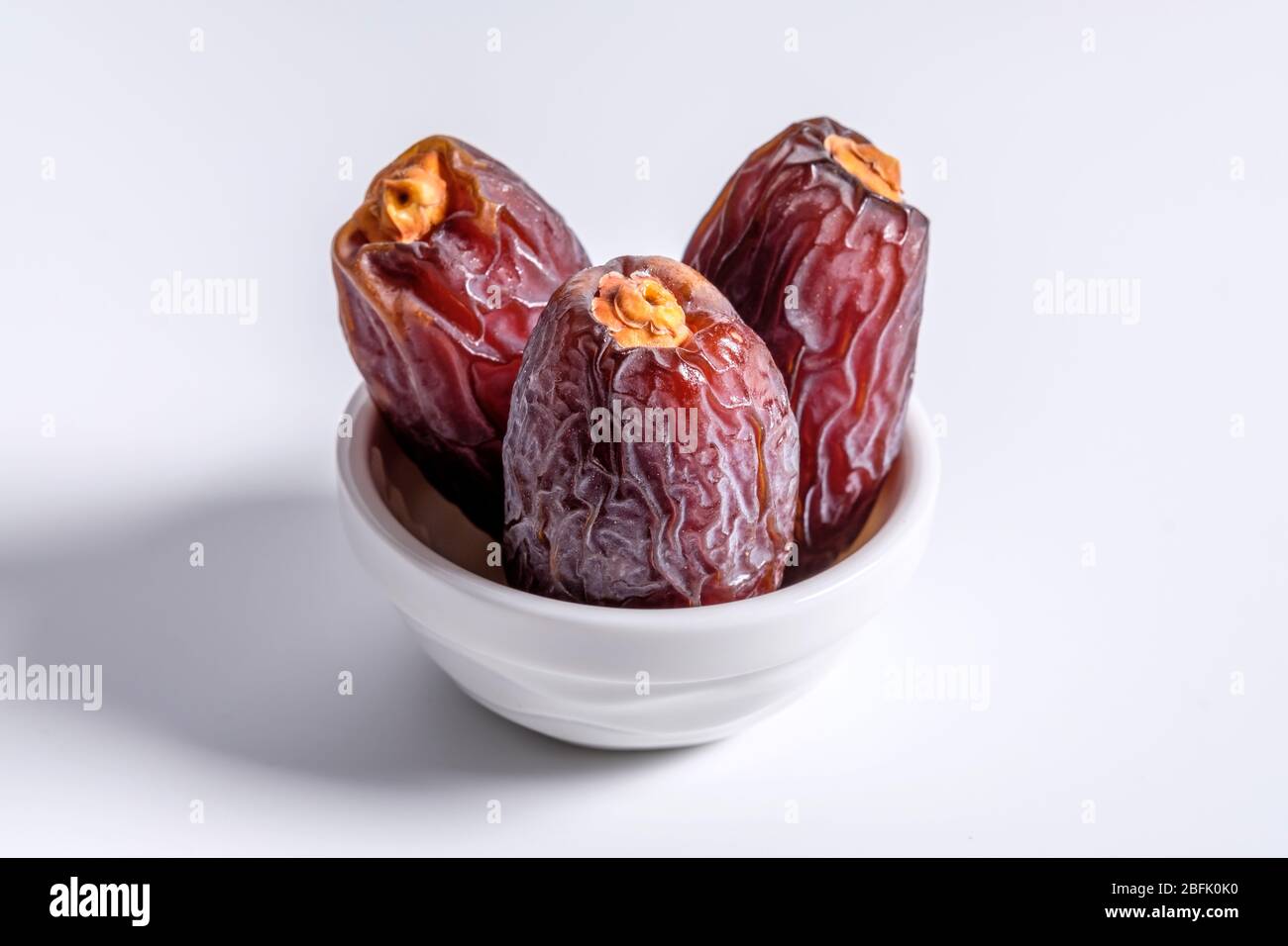 Dried dates fruit isolated on white Stock Photo