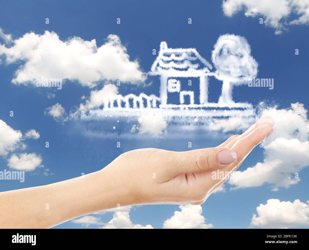 House clouds shape floating on hand Stock Photo - Alamy