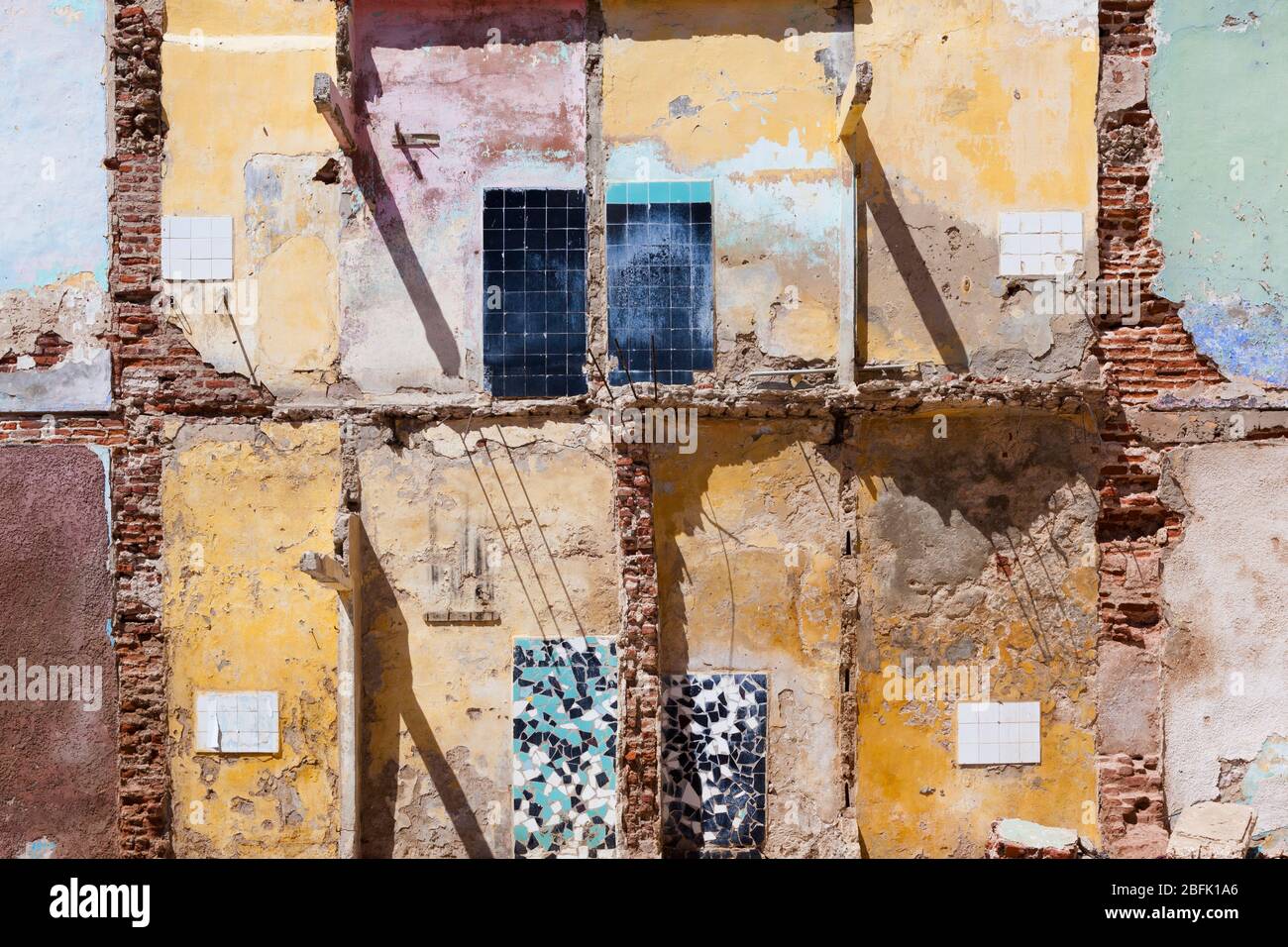 Interior house paint and tiles exposed by demolition in the old quarter of Saint Louis, Senegal. Stock Photo