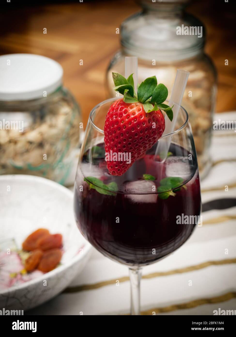 Strawberry cocktail on the coffee table with snacks. Stock Photo