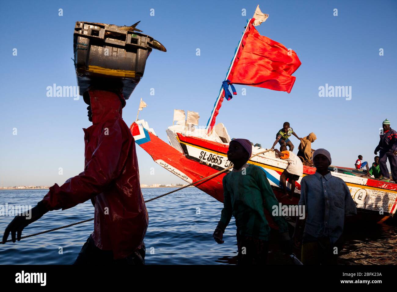 Fishermen unloading the day's catch at Guet Ndar, Saint Louis, Senegal. Stock Photo