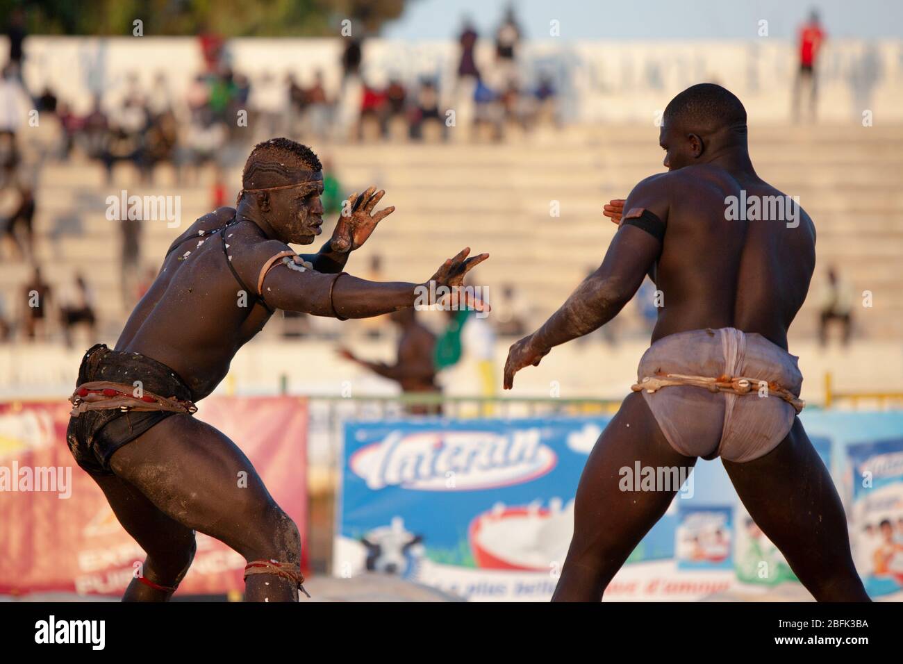 Wrestlers feeling each other out during the early stages of a match in Dakar, Senegal. Stock Photo