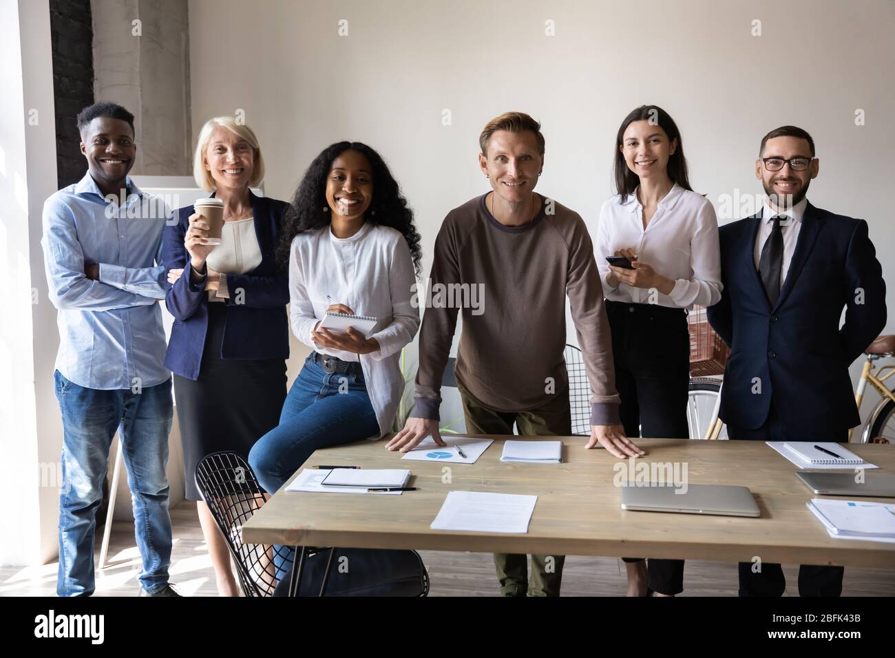 Portrait of smiling diverse employees posing together in office Stock ...