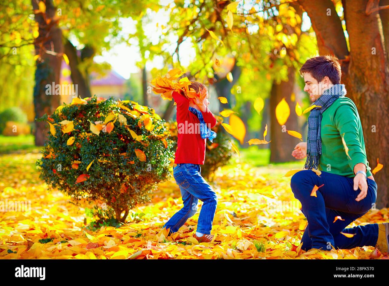 happy family having fun in colorful autumn park Stock Photo - Alamy