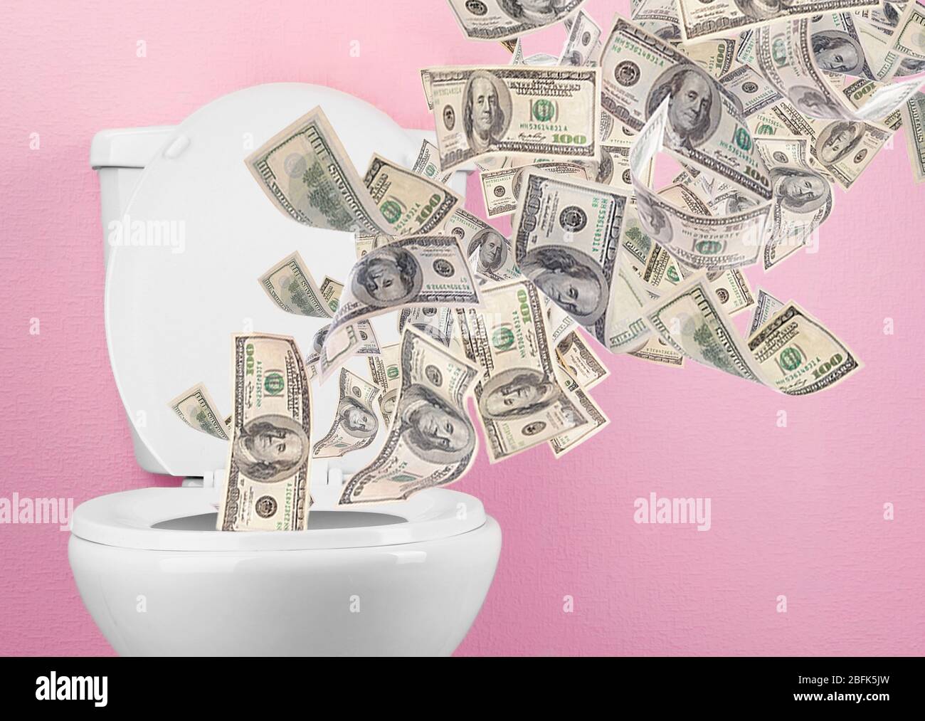 A lot of money is flushed down the toilet Stock Photo Alamy