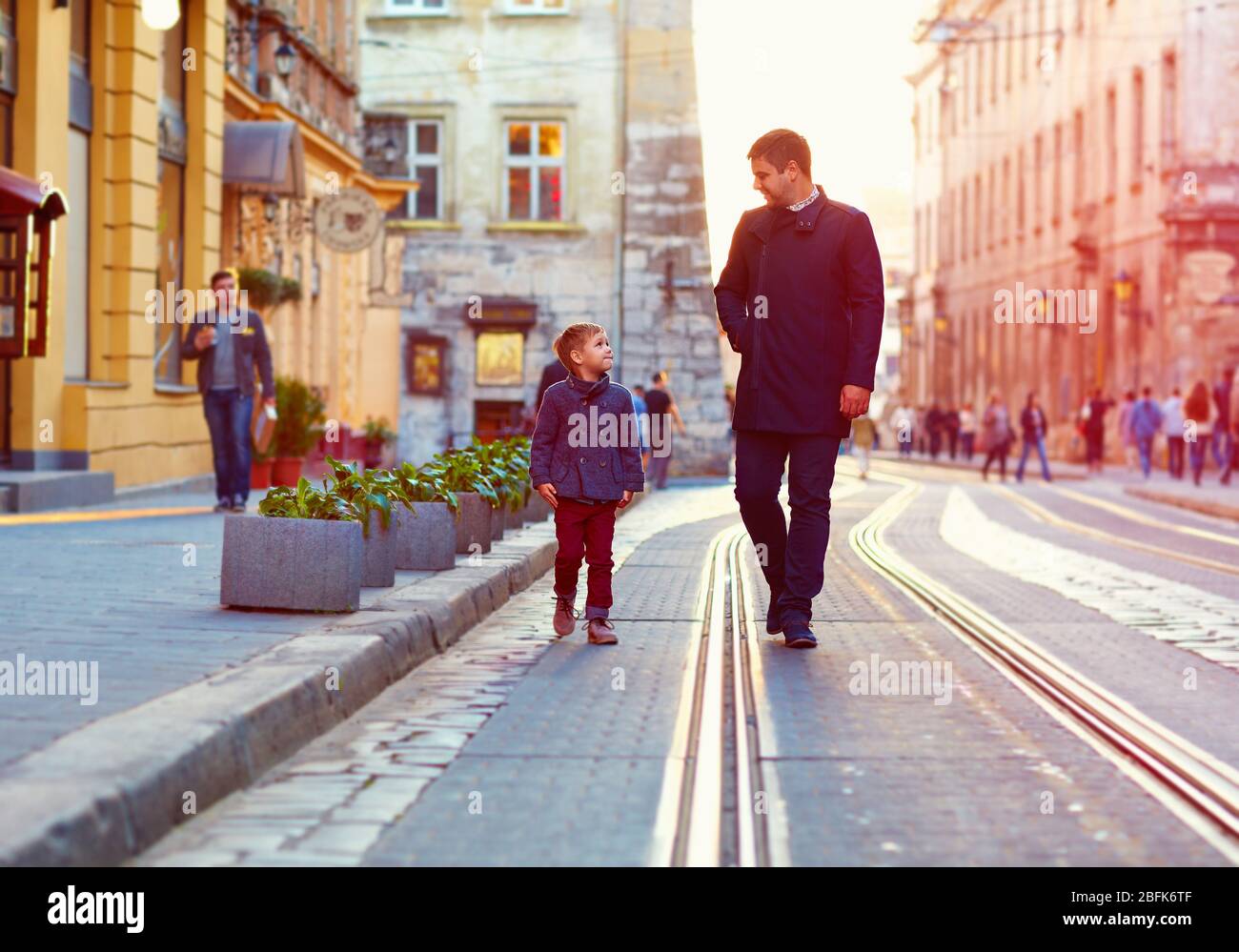 Сын пошел в отца на кармане. Отец выслушивает ребенка. Сын пошел в отца на кармане. Отец с сыном гуляют. Папа и сын идут в школу.