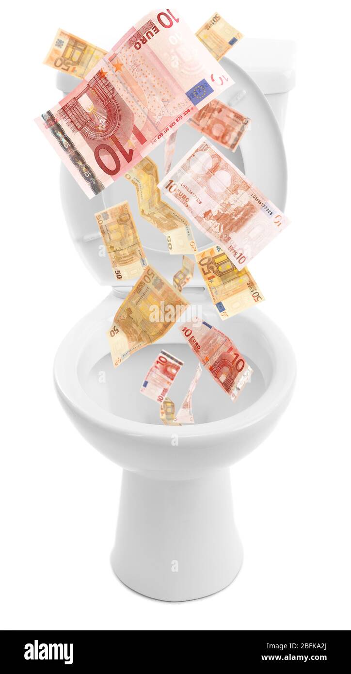 A lot of money is flushed down the toilet, isolated on white Stock