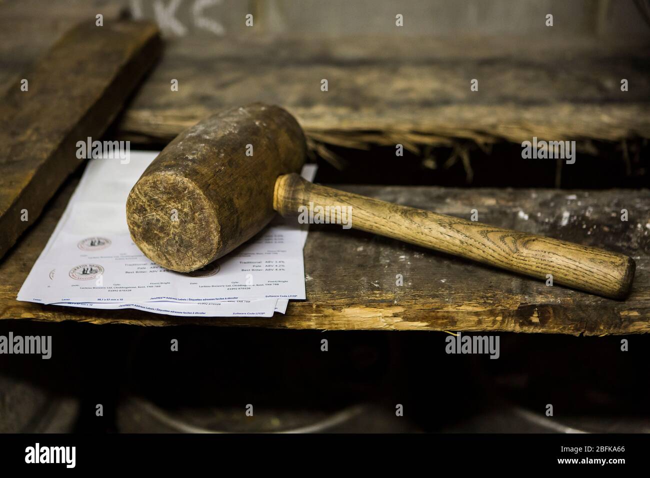 Wooden bung hammer at Larkins Brewery award winning brewery and hop farm in Chiddingstone, Kent, UK Stock Photo