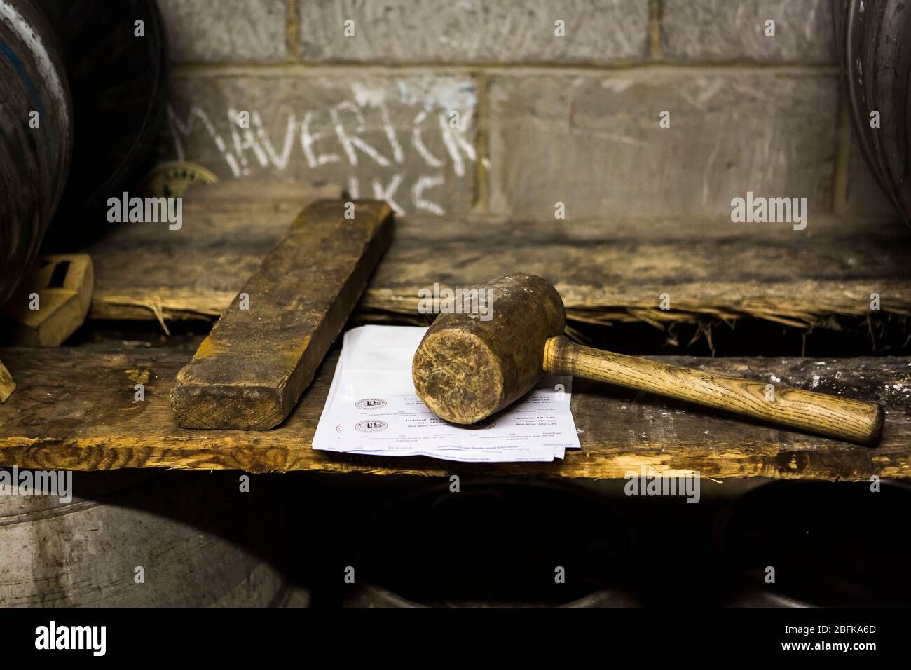 Wooden bung hammer at Larkins Brewery award winning brewery and hop farm in Chiddingstone, Kent, UK Stock Photo