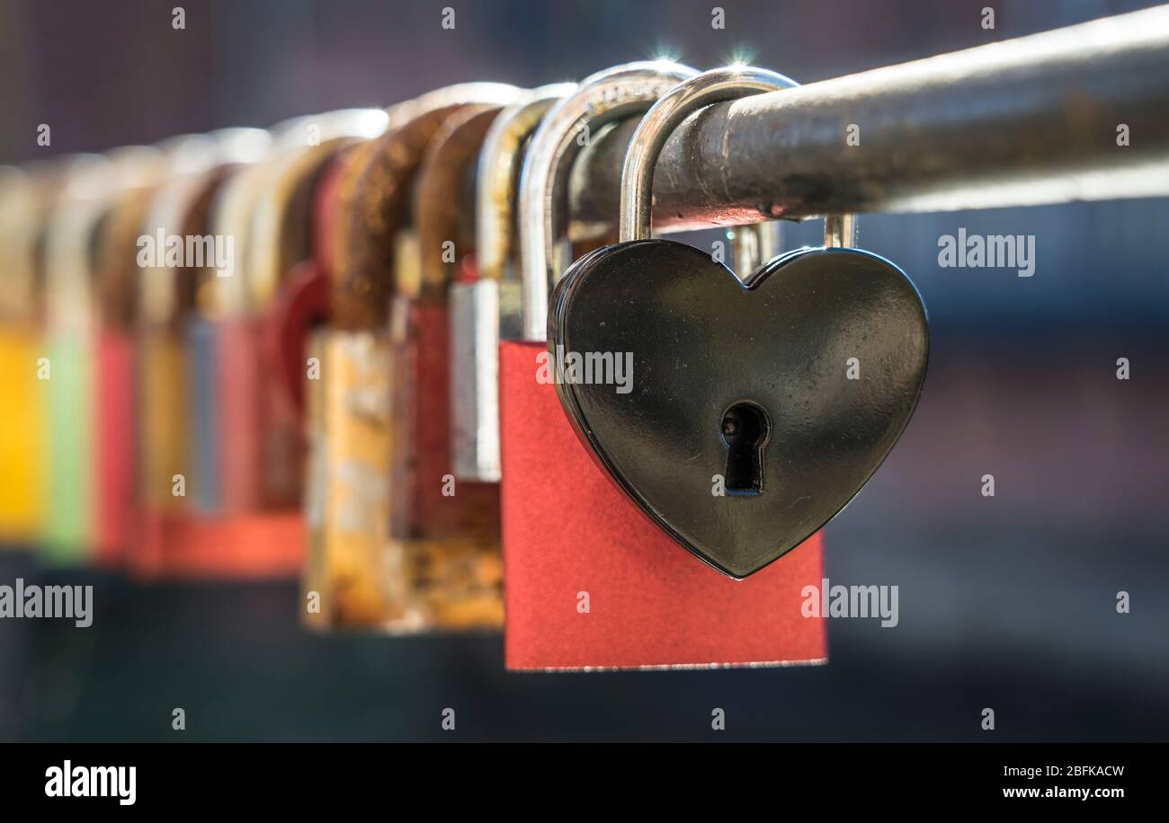 Love padlocks on a bridge rail Stock Photo Alamy