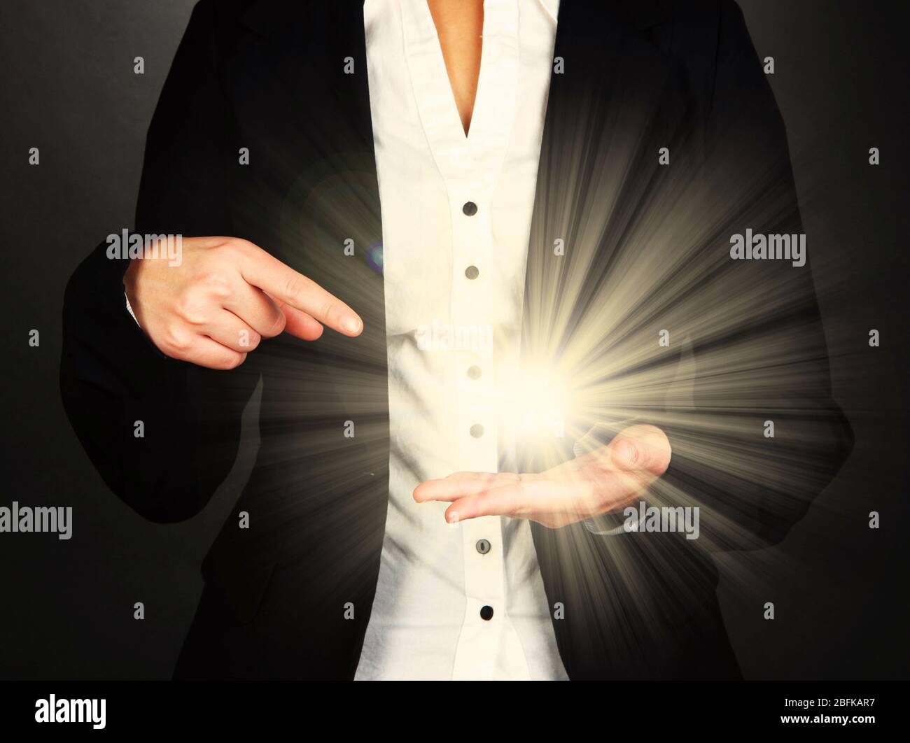 The light in young woman hands Stock Photo