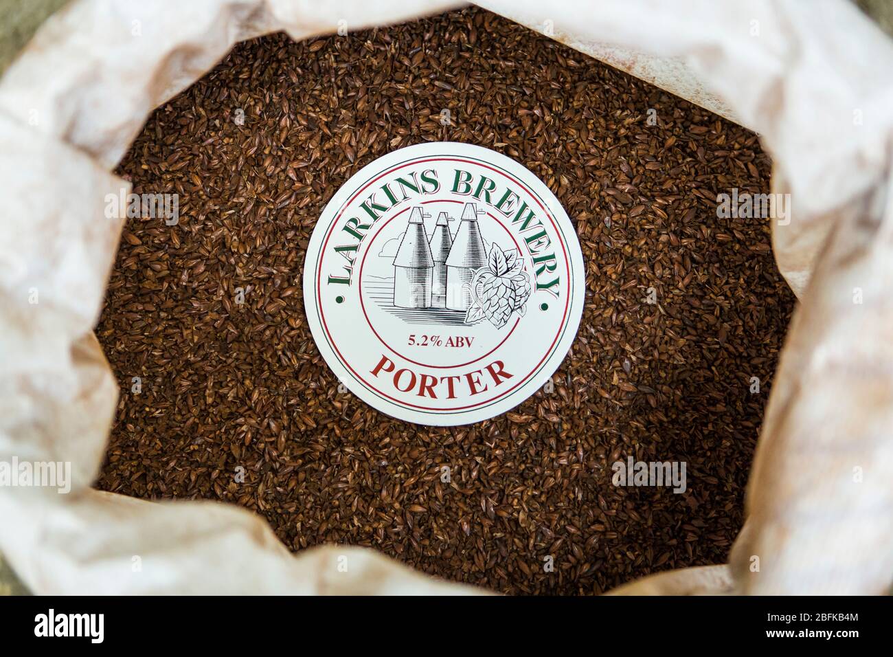 Toasted malted barley ready to brew up Larkins' award winning Porter by Larkins Brewery and hop farm in Chiddingstone, Kent, UK Stock Photo