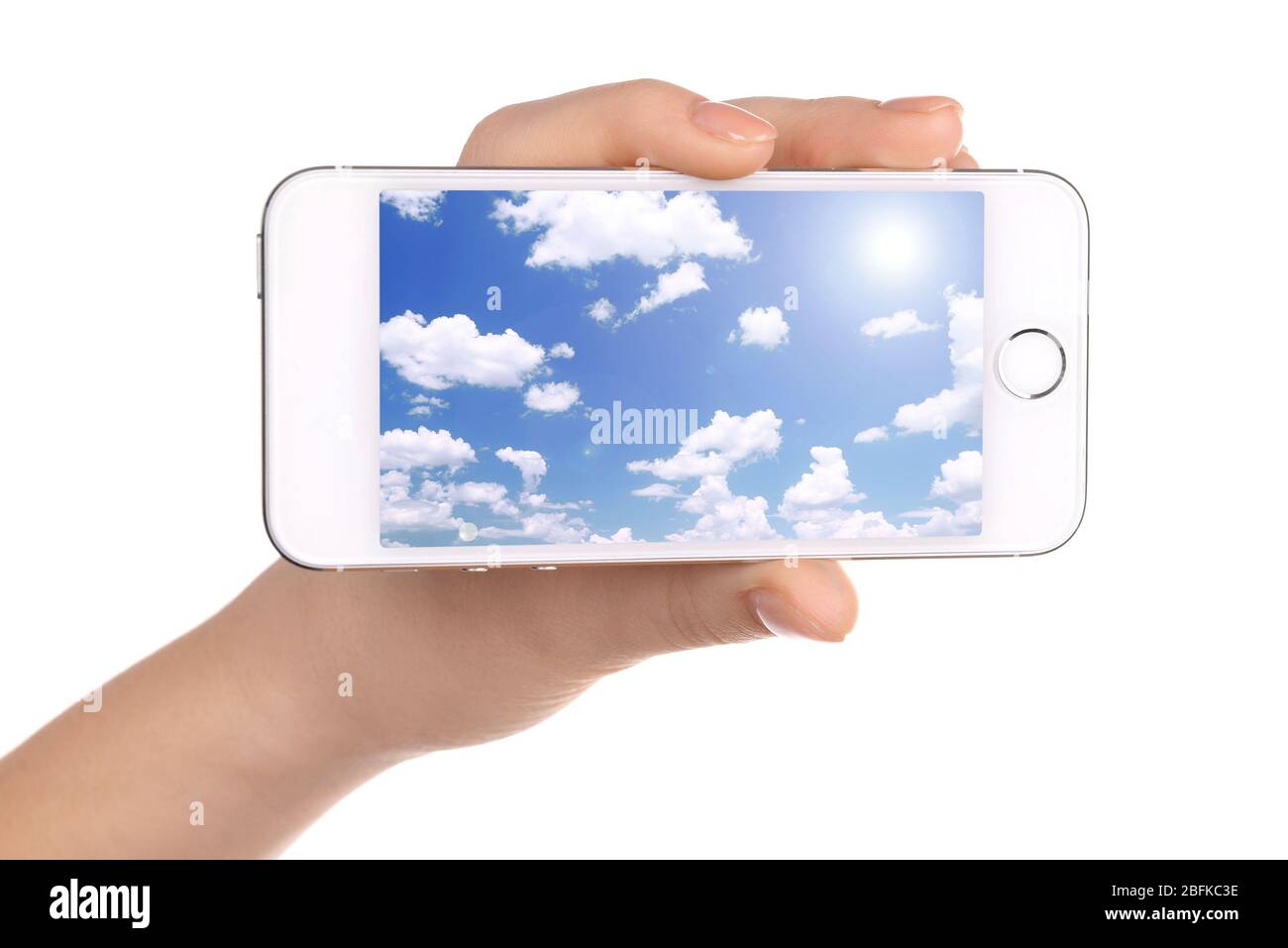 Hand holding mobile smart phone with sky in screen. Cloud computing ...