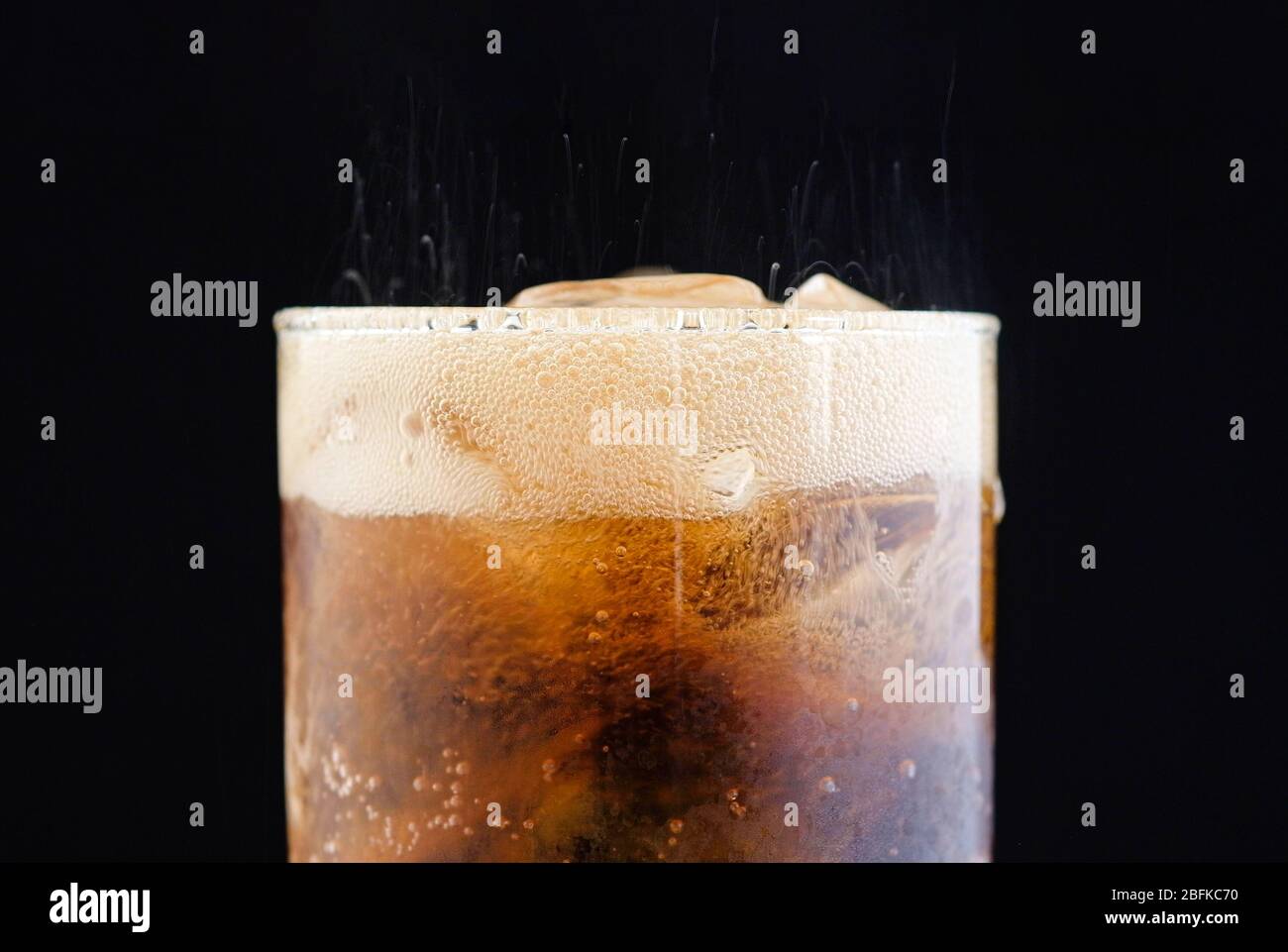 ice cube in fizzy splashing water with soda bubble Stock Photo - Alamy