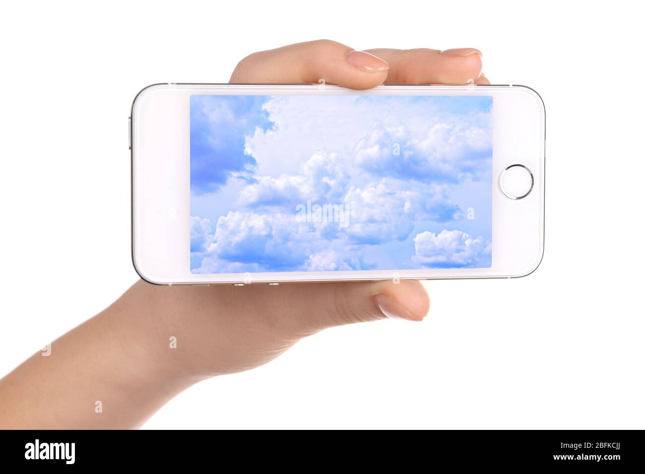 Hand holding mobile smart phone with sky in screen. Cloud computing ...