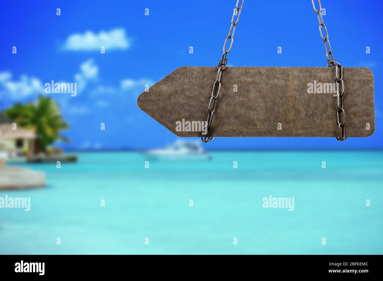 Wooden sign arrow on nature background Stock Photo - Alamy