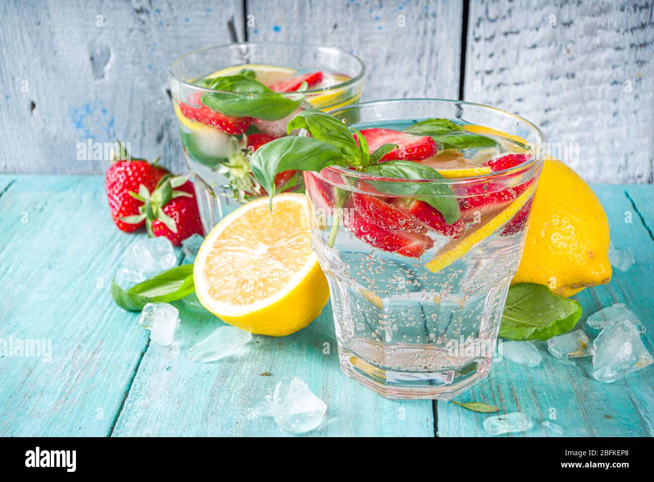 Strawberries And Basil Lemonade Summer Cold Iced Cocktail Recipe With Fresh Strawberry Lemon And Basil Leaves Wooden Background Copy Space Stock Photo Alamy