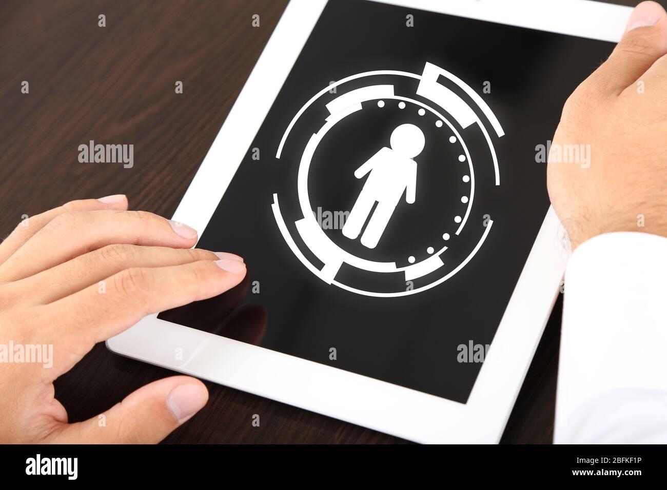 Businessman holding tablet-pc with social network structure on screen Stock Photo