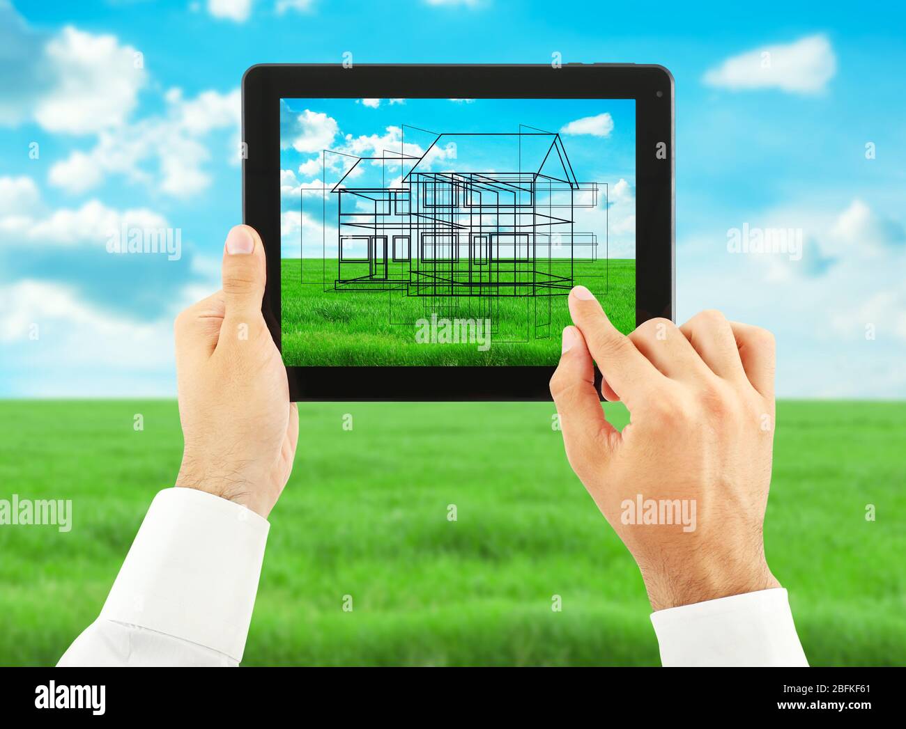 Architect showing new house project on tablet-pc, close up Stock Photo