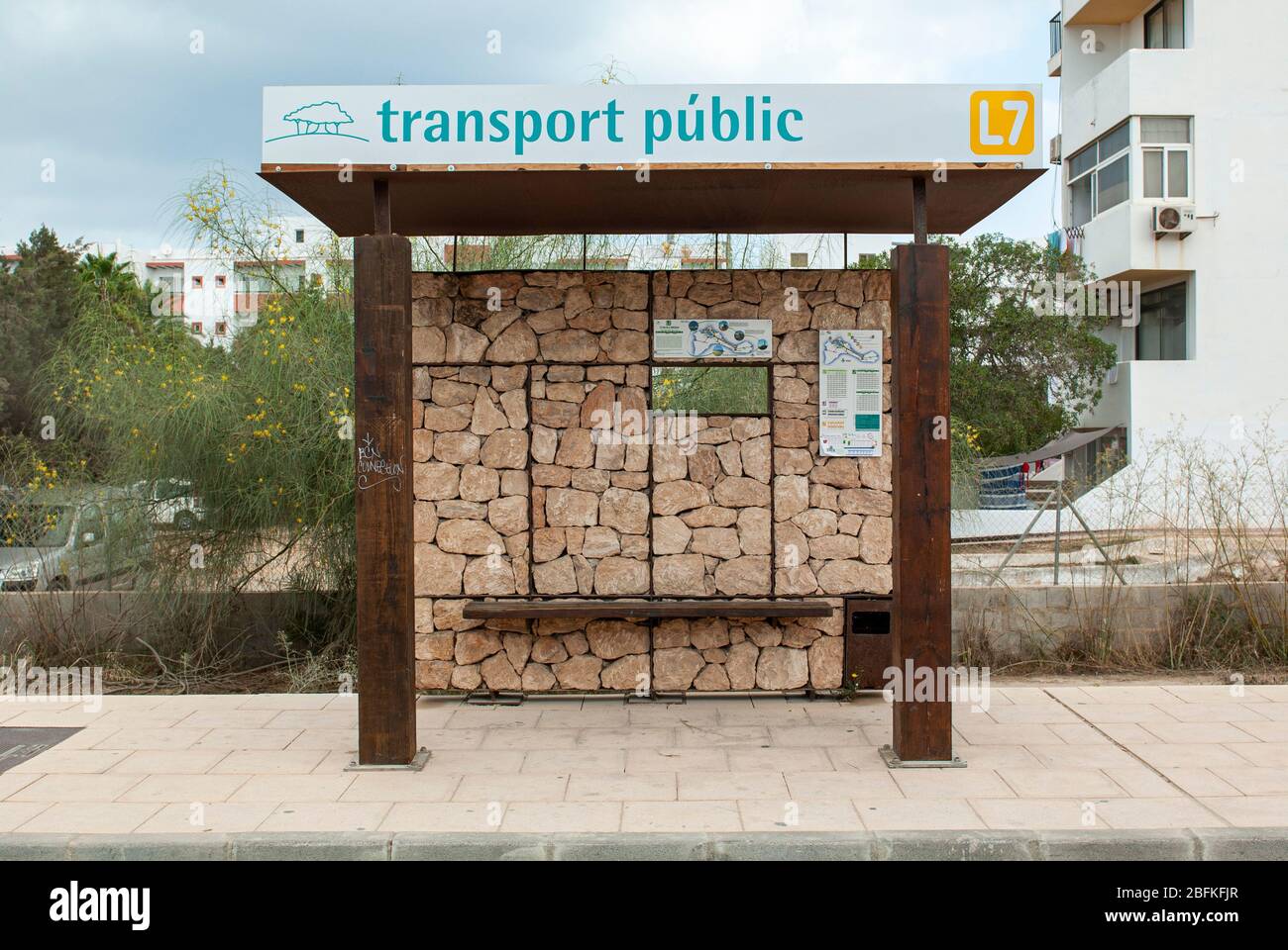 Es Pujols, Formentera, Balearic Island, Spain. Bus stop in wood and stone of the public transport that connects the various places of the island. Stock Photo