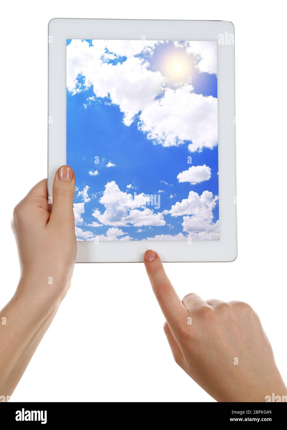Hands holding tablet PC with sky in screen. Cloud computing concept Stock Photo
