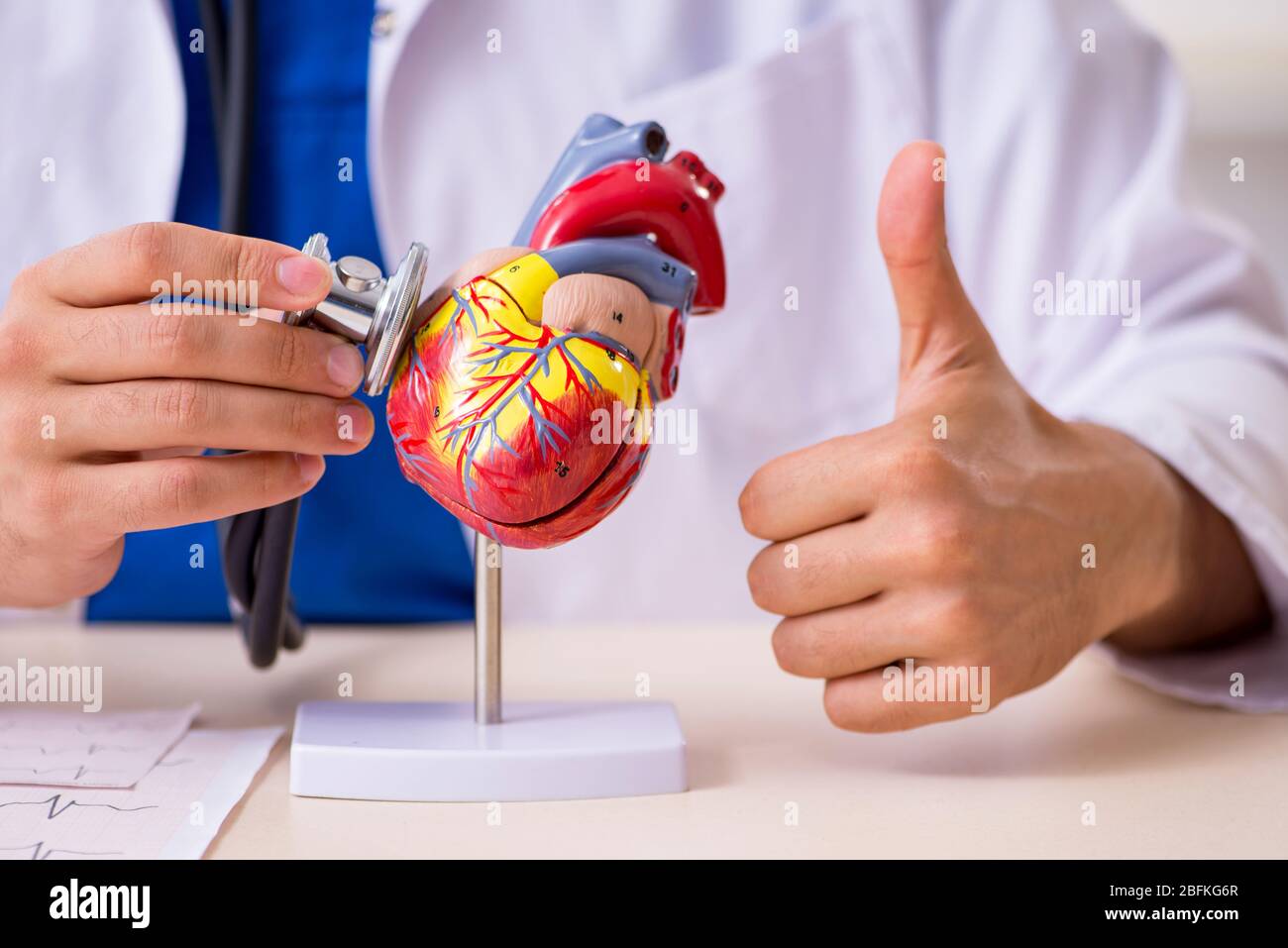 Young doctor cardiologist working in the clinic Stock Photo - Alamy