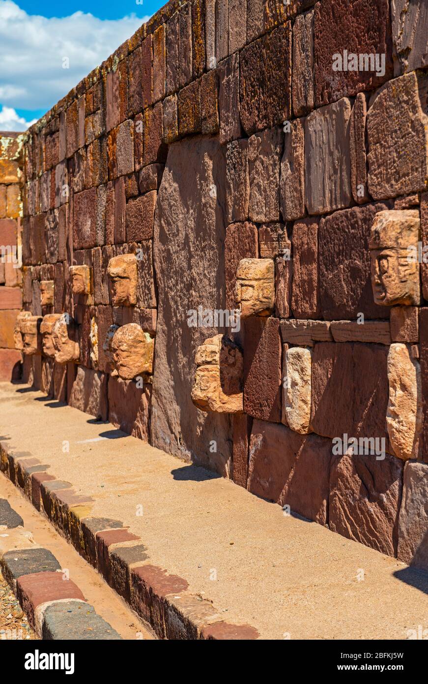 Carved Stone Head Sculptures of ancestors in the semi subterranean courtyard temple in Tiwanaku, La Paz, Bolivia. Stock Photo