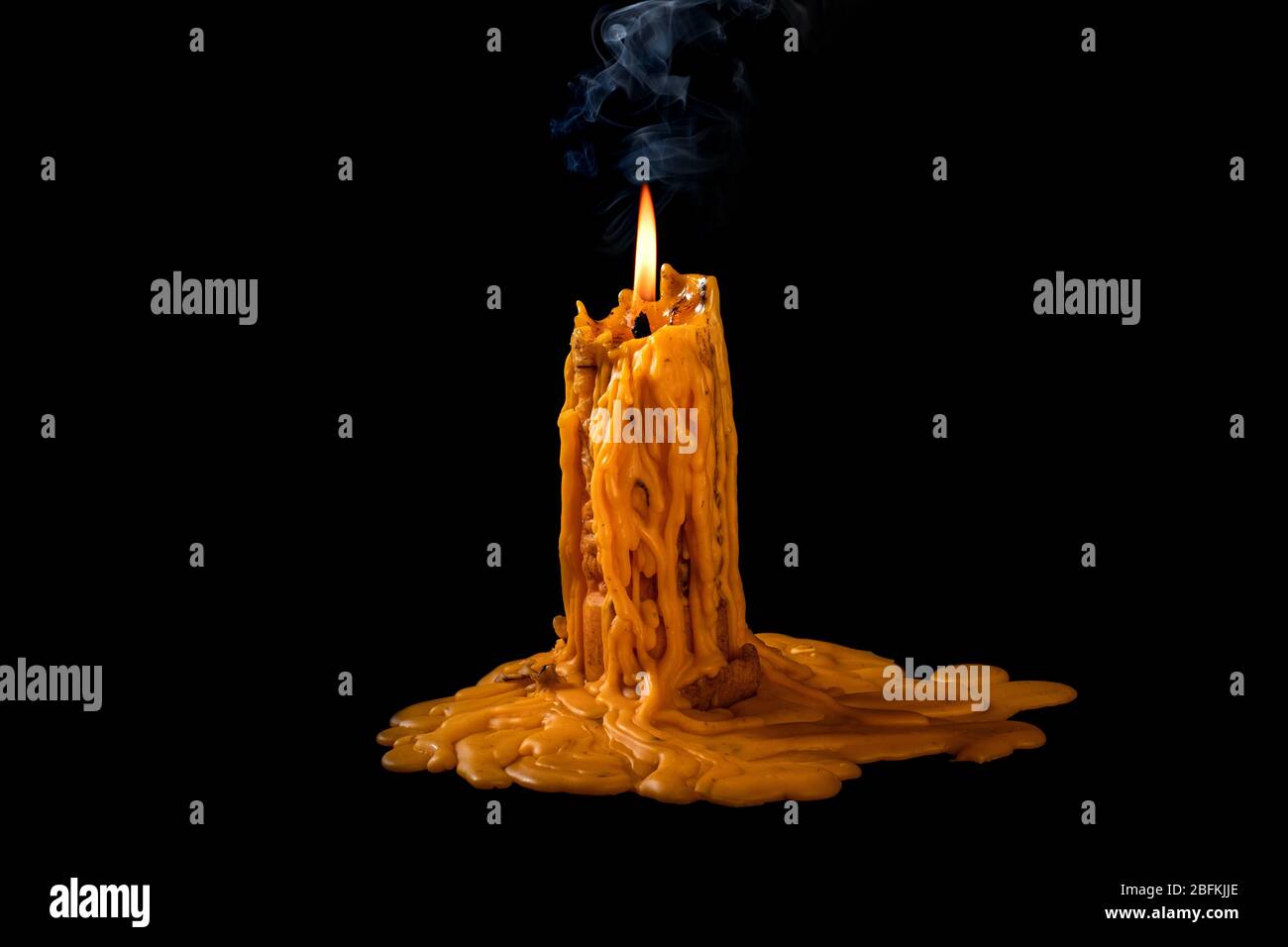 light flame candle burning brightly on black background Stock Photo