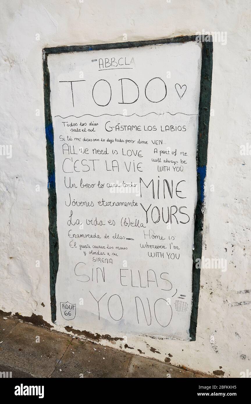 Various street slogans on a white wall in Santa Cruz de La Palma downtown (La Palma, Canary Islands, Spain) Stock Photo