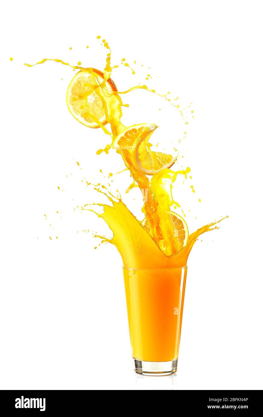 Juice splash in glass with orange slices isolated on white Stock Photo