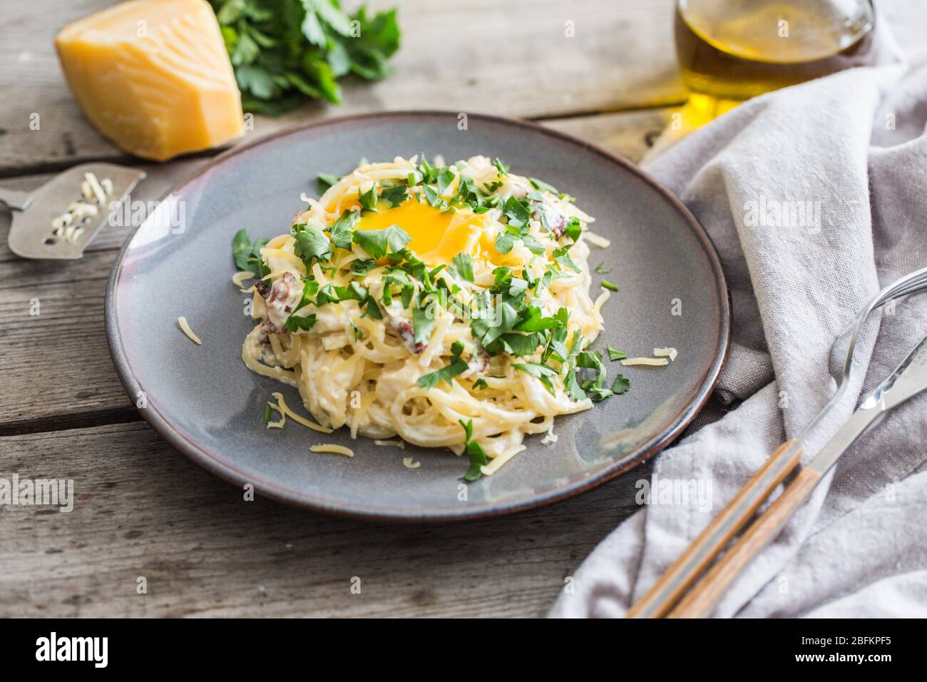 Spaghetti Carbonara with bacon, cheese and egg yolk. selective focus