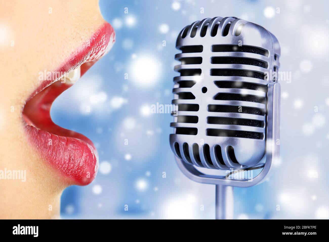 Singing woman and retro microphone over snow effect Stock Photo Alamy